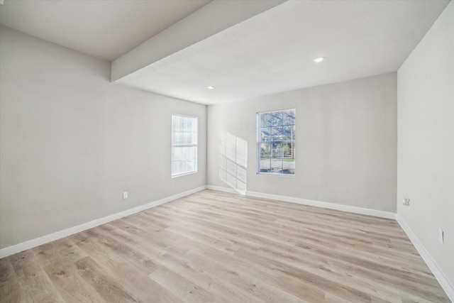 spare room with light wood-type flooring