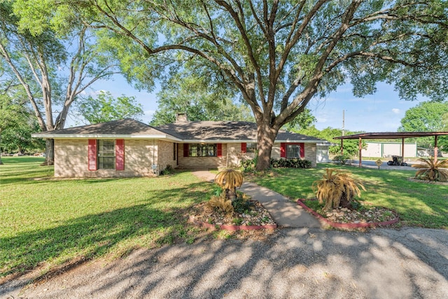 ranch-style house with a carport and a front yard