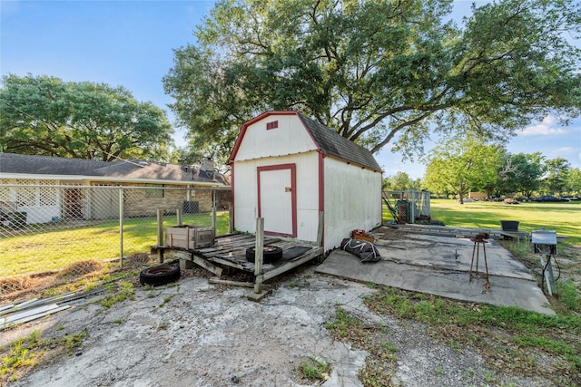 view of outdoor structure with a lawn