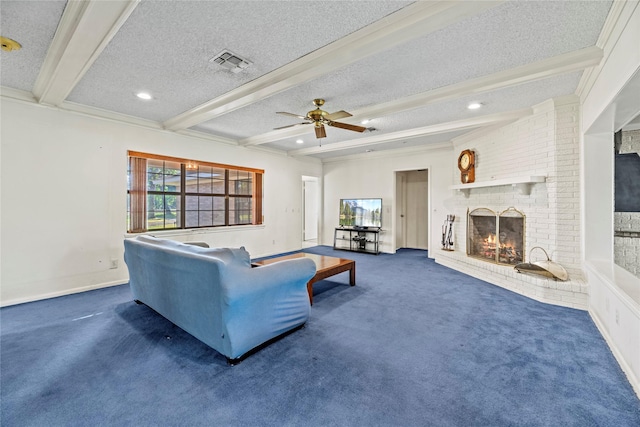 carpeted living room featuring beam ceiling, ceiling fan, crown molding, a textured ceiling, and a fireplace