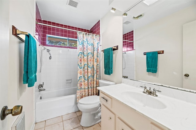 full bathroom featuring tile patterned flooring, vanity, toilet, and shower / tub combo