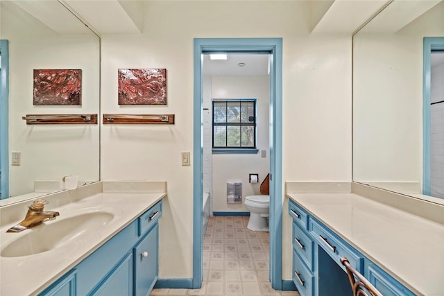 bathroom featuring vanity, toilet, and heating unit