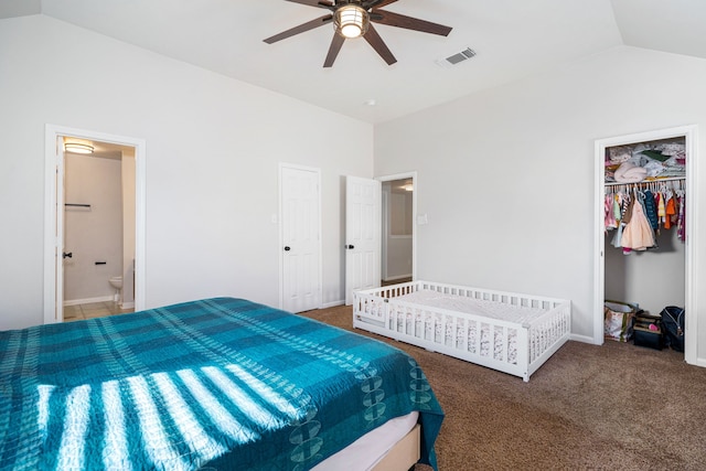 carpeted bedroom featuring ensuite bath, ceiling fan, a closet, and lofted ceiling