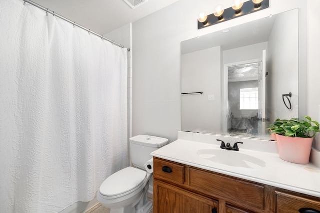 bathroom with visible vents, curtained shower, vanity, and toilet