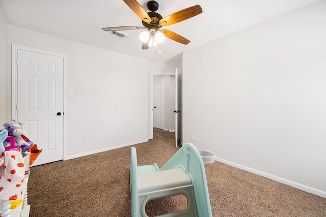 carpeted bedroom with ceiling fan