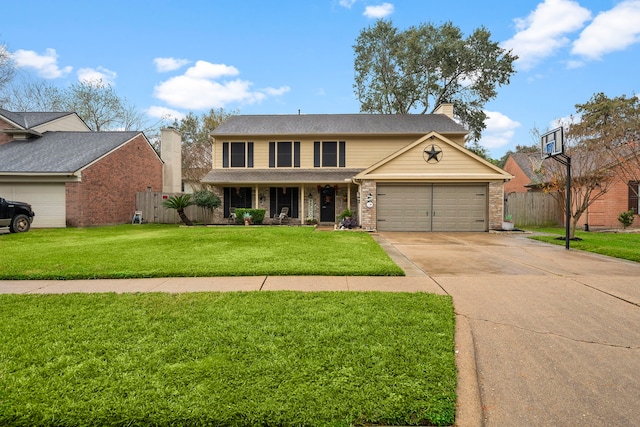 view of front of property featuring a front yard and a garage