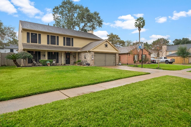 view of front of house with a front yard and a garage