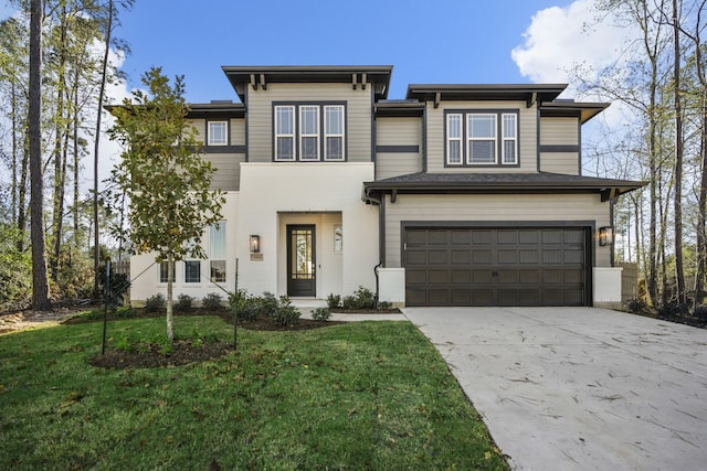 view of front facade featuring a front yard and a garage