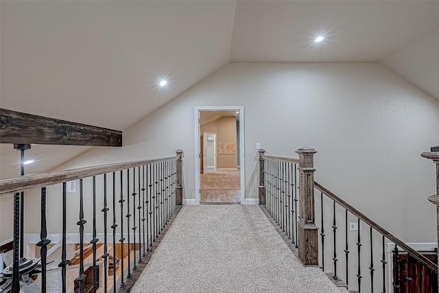 hall featuring carpet and lofted ceiling