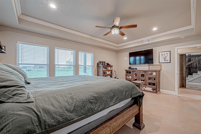 bedroom with a tray ceiling, ceiling fan, and crown molding