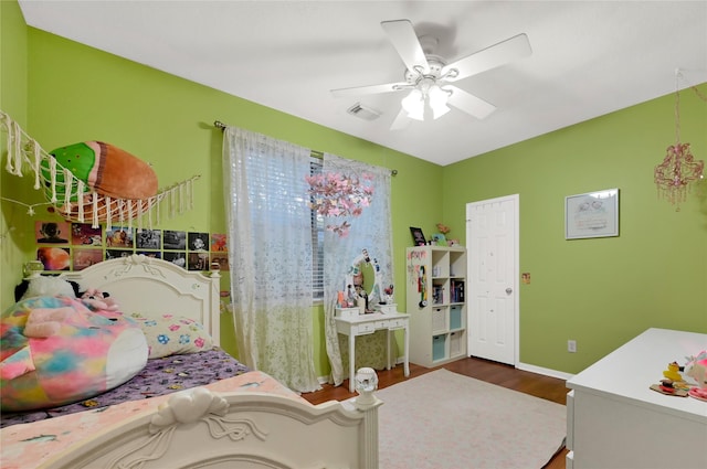 bedroom with hardwood / wood-style floors and ceiling fan