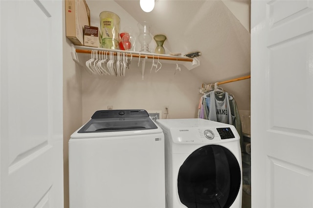 clothes washing area featuring independent washer and dryer