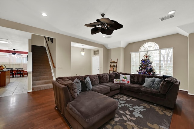 living room featuring hardwood / wood-style flooring and ceiling fan