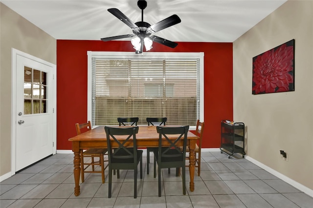 tiled dining room featuring ceiling fan