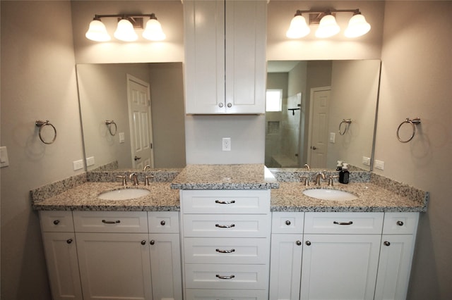 bathroom featuring vanity and walk in shower