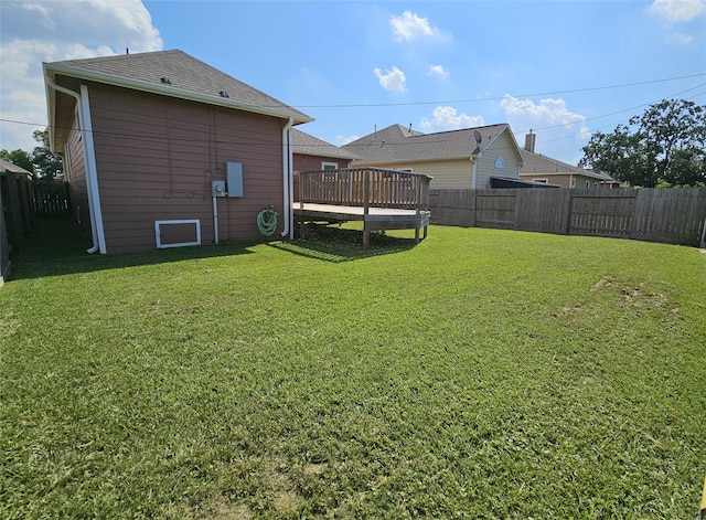 view of yard featuring a wooden deck