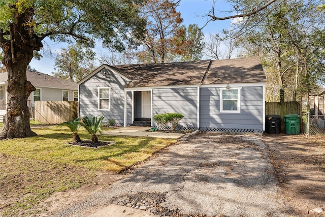 ranch-style house with a front lawn