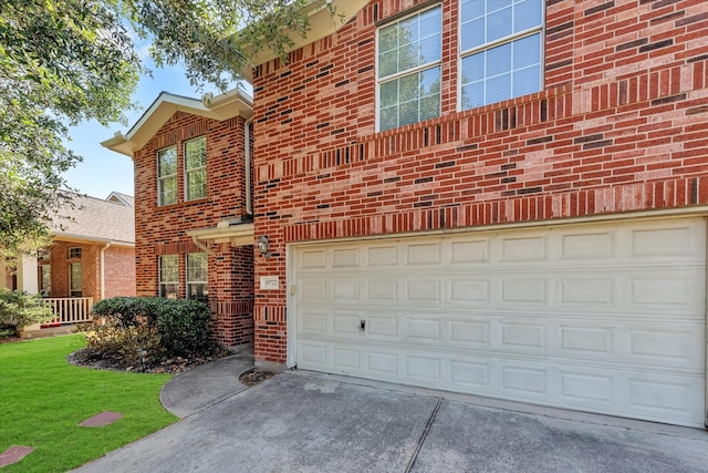 view of front of home featuring a garage and a front lawn