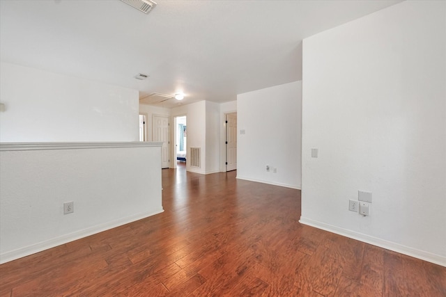 spare room with dark hardwood / wood-style floors