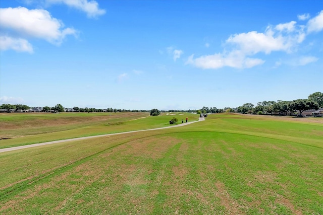 view of property's community with a lawn