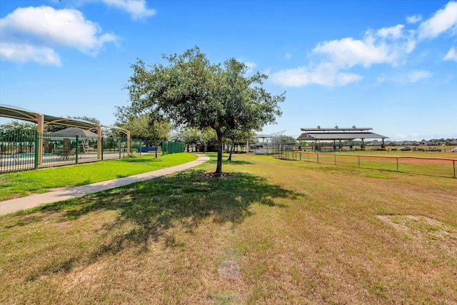 view of property's community with a lawn