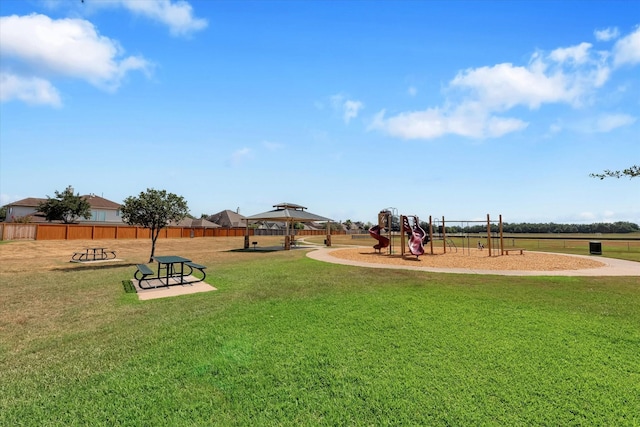 view of yard featuring a gazebo and a playground