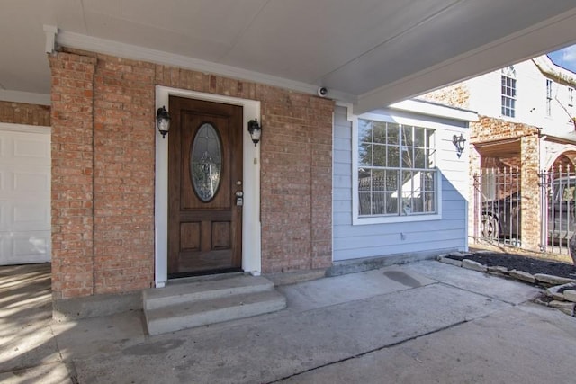 doorway to property featuring a garage