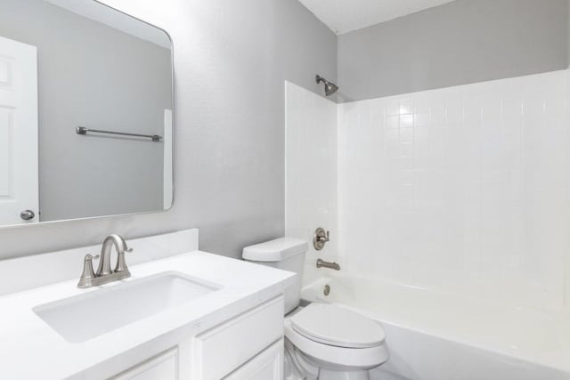 full bathroom featuring vanity, toilet, and tub / shower combination