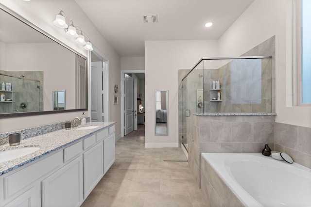 bathroom with separate shower and tub and vanity