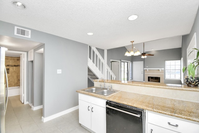 kitchen with ceiling fan, sink, decorative light fixtures, white cabinets, and black dishwasher