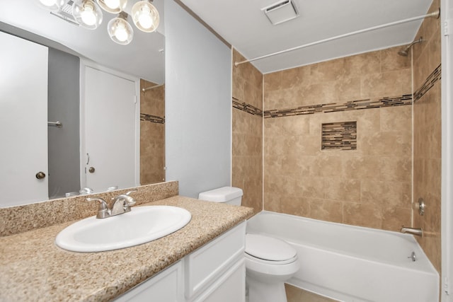 full bathroom with vanity, toilet, and tiled shower / bath combo