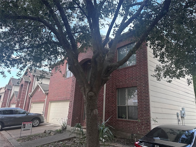 view of side of home featuring a garage