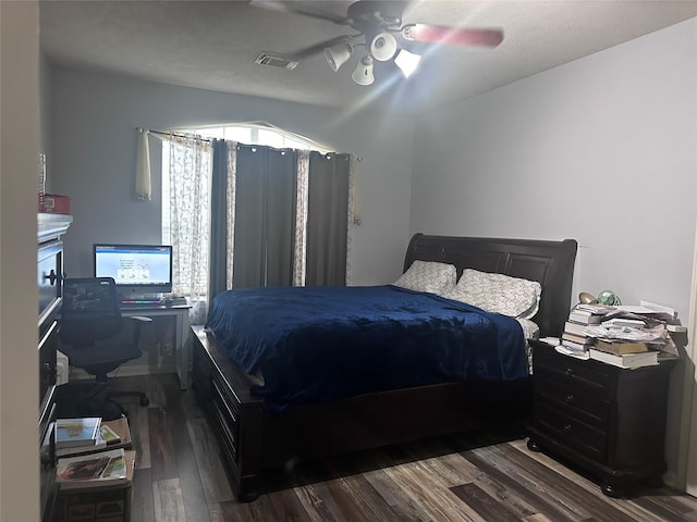 bedroom featuring ceiling fan and dark hardwood / wood-style flooring