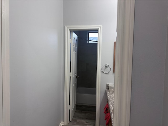 corridor featuring hardwood / wood-style floors