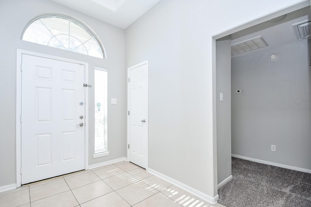 entryway with light tile patterned floors