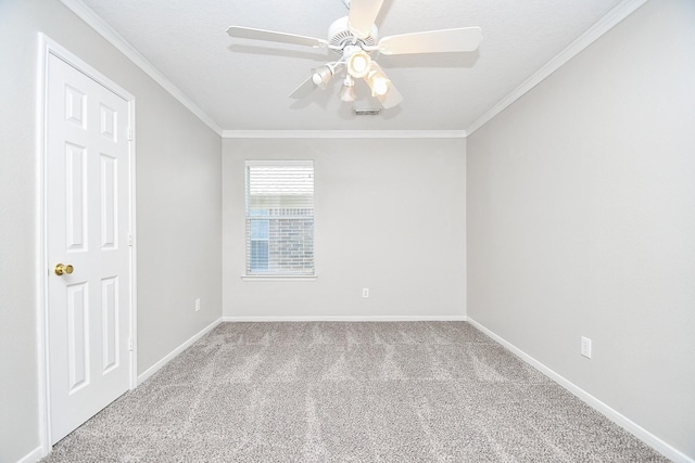 unfurnished room with ceiling fan, light colored carpet, and ornamental molding