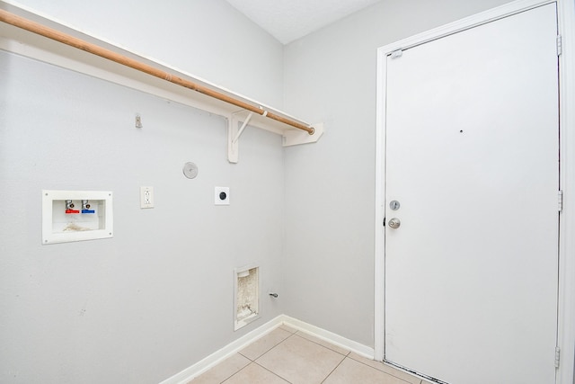 clothes washing area featuring washer hookup, light tile patterned floors, hookup for a gas dryer, and hookup for an electric dryer