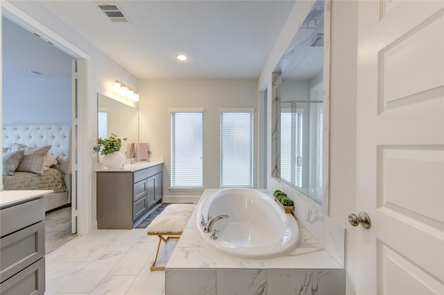 bathroom featuring shower with separate bathtub and vanity