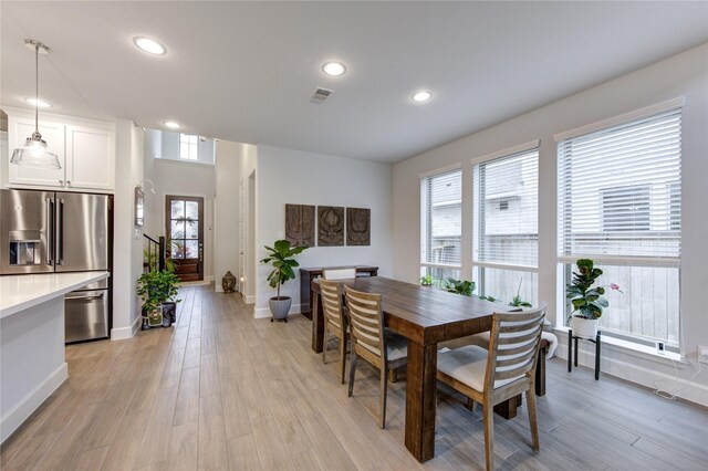 dining area with light hardwood / wood-style flooring