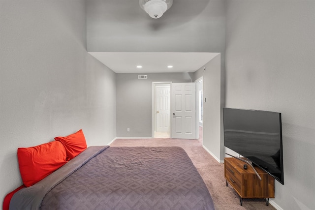 bedroom featuring light carpet