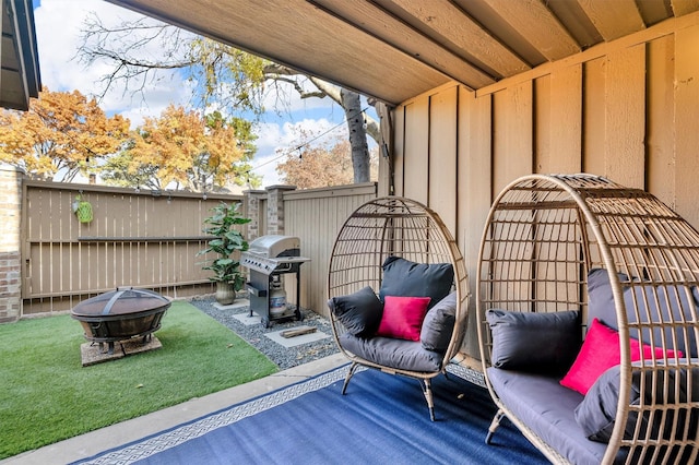 view of patio with a fire pit and grilling area