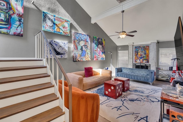 living room featuring beamed ceiling, ceiling fan, and high vaulted ceiling