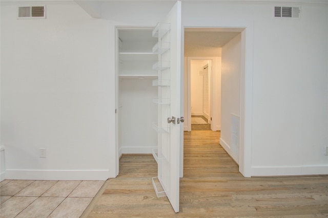 corridor featuring light wood-type flooring