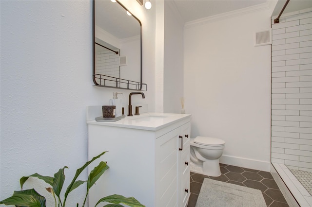 bathroom with tile patterned flooring, ornamental molding, vanity, walk in shower, and toilet