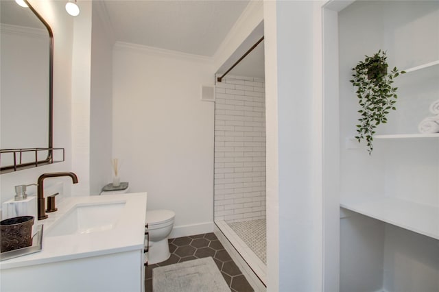 bathroom with tile patterned flooring, crown molding, toilet, and tiled shower