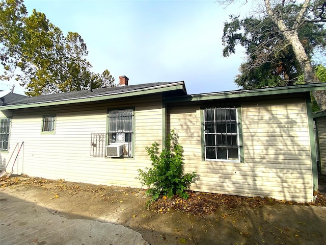 view of side of home with cooling unit