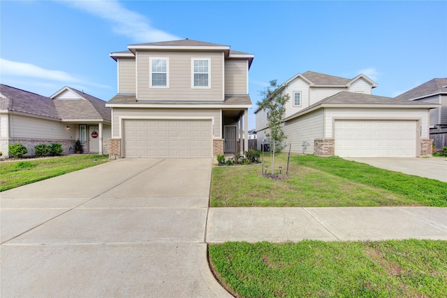 view of property featuring a front yard and a garage