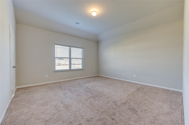 spare room with light carpet