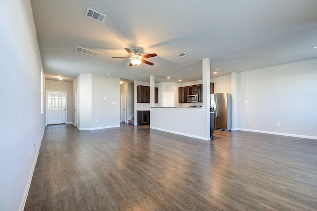 unfurnished living room featuring dark hardwood / wood-style flooring and ceiling fan