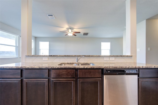 kitchen featuring ceiling fan, dishwasher, sink, a healthy amount of sunlight, and kitchen peninsula